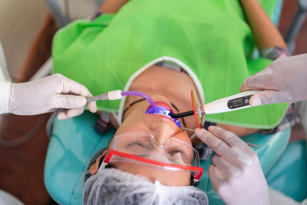 Client Getting Tooth Whitening Laser Treatment Dental Clinic 385881 1056
