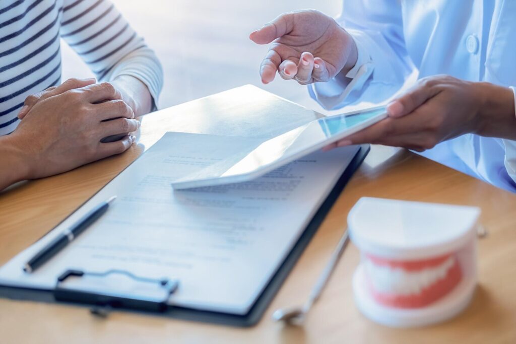 Midsection Female Dentist Explaining Customer Digital Tablet Desk Clinic 1048944 24641076 Midsection Female Dentist Explaining Customer Digital Tablet Desk Clinic 1048944 24641076