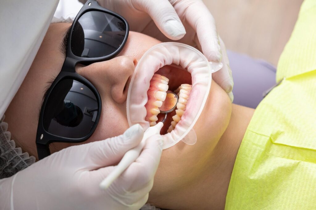 Dentist Examining Patients Mouth With Dental Mirror Clinic 130111 8992 Dentist Examining Patients Mouth With Dental Mirror Clinic 130111 8992